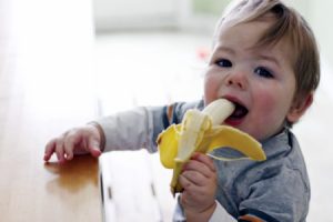 child-eating-a-banana